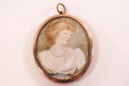 Early 20th century School, portrait miniature of a lady, watercolour on ivory,