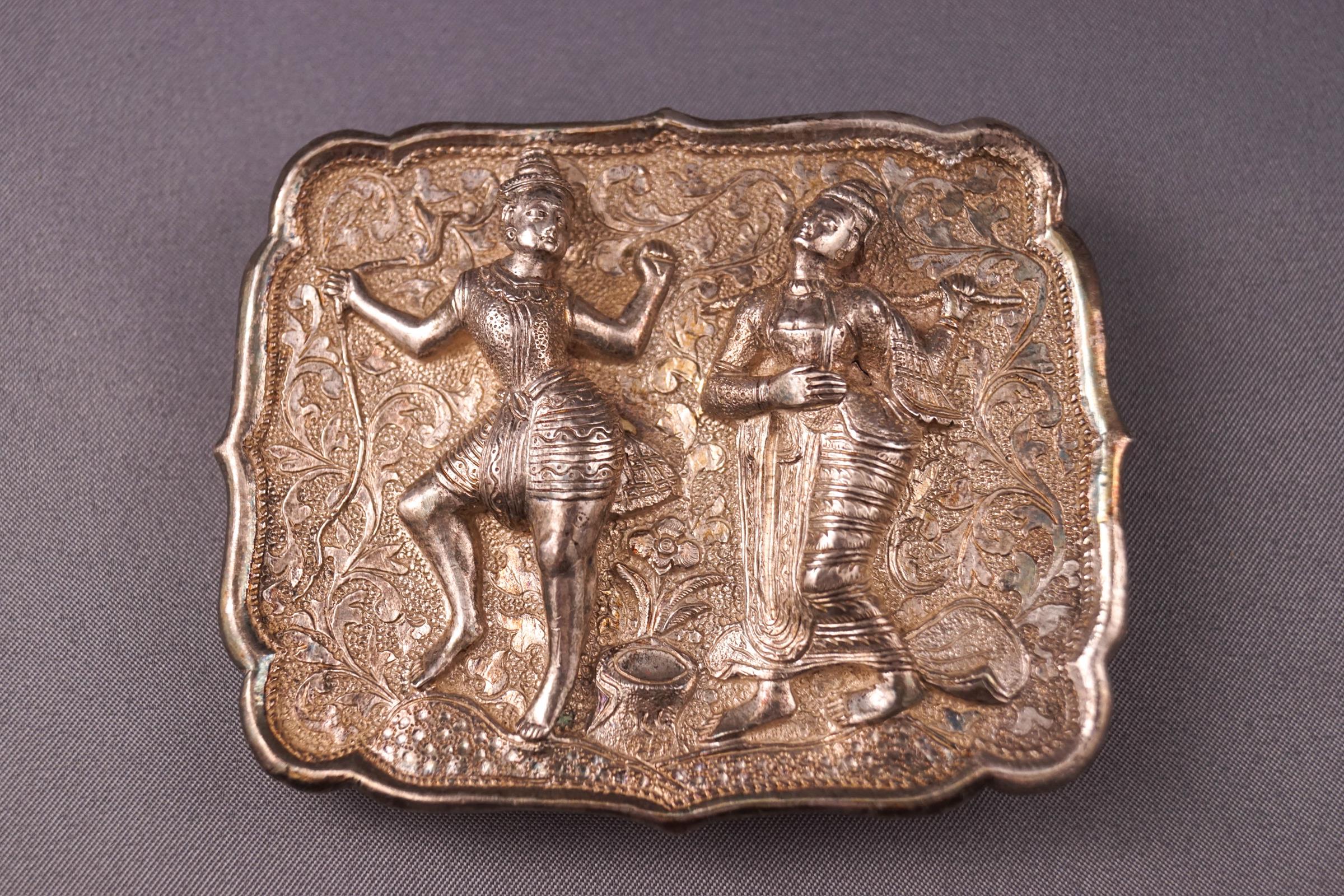 A Burmese white metal buckle,