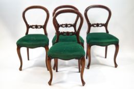 A set of four Victorian mahogany balloon back chairs,