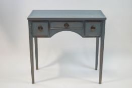 A blue painted mahogany dressing table with three drawers on square tapering legs,
