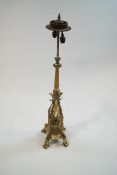 A 19th century plated brass altar type twin candlestick, adapted for electricity,