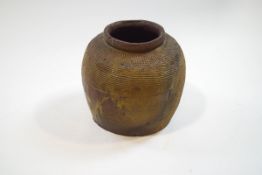 A Korean (?) earthenware jar with impressed hobnail pattern and linear design,