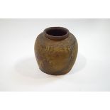 A Korean (?) earthenware jar with impressed hobnail pattern and linear design,