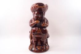 A Victorian treacle glazed Toby jug and lid,