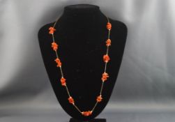 An 18 carat coral and pearl necklace. Stamped 750. Bolt ring clasp, 640mm. Gross weight: 12.