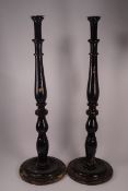 A pair of 19th century tall candlesticks,