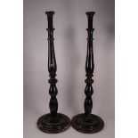 A pair of 19th century tall candlesticks,