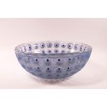 A Rene Lalique, frogspawn pattern bowl, frosted in blue, moulded mark, 10cm high x 25.5cm diameter.