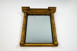 A Regency rectangular giltwood wall mirror, with column mounts,