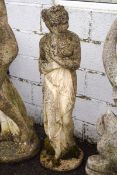 A large garden re-constituted stone sculpture of a classical lady,