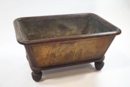 A William IV mahogany wine cooler on heavily carved and turned feet with tin liner,