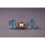 A yellow metal freshwater pearl ring together with a pair of silver blue glass earrings.