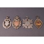 Four silver fob medallions with vacant cartouches including two with gold panels,