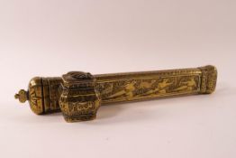A Middle Eastern brass pen box with attached inkwell, engraved with figures and animals,