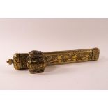 A Middle Eastern brass pen box with attached inkwell, engraved with figures and animals,