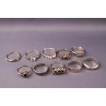 A white metal and single stone ring and a white metal wishbone ring, both marked 925,