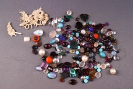 A collection of loose gem stones to include cabochon moonstones, garnets, blood stone signets,