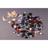 A collection of loose gem stones to include cabochon moonstones, garnets, blood stone signets,