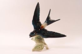 A Goebel porcelain figure of a Red Rumped Swallow in flight, 21.