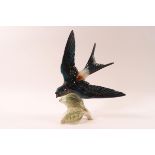 A Goebel porcelain figure of a Red Rumped Swallow in flight, 21.