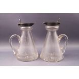 A pair of silver mounted conical glass whiskey noggins, Birmingham 1906-07 by Hukin & Heath,