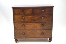 A Victorian mahogany chest of two short and three long drawers with turned handles and legs,