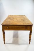 A Victorian pine kitchen table with a drawer to either end with turned handles and legs,