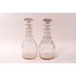 A pair of 19th century cut glass triple ring necked decanters and stoppers, 21.