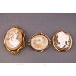 A collection of three brooches to include two cameo brooches and a mourning brooch.