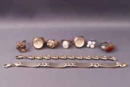 A collection of sterling silver jewellery to include two bracelets and seven dress rings.