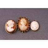 A collection of three cameo items to include two brooches and one pendant,