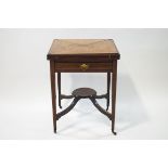 A 19th century rosewood envelope card table with single drawer upon square tapering legs joined by