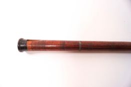 A walking cane in the form of a flute,