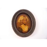 A late 18th century oval miniature portrait on glass, circa 1800,