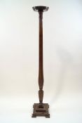 A William IV style mahogany torchere with reeded and fluted column carved with sheafs of wheat,
