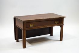 A mahogany drop leaf coffee table with one frieze drawer and square legs,