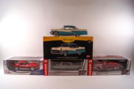 Four boxed 1:18 scale model cars, An Auto World 1957 Chrysler 300C and a 1937 Cord 812 convertible,