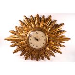 A Smiths battery sunburst wall clock,