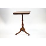A Victorian mahogany tripod table with rectangular tilt top, turned pedestal and splayed legs,