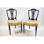 A pair of George III style shield back mahogany chairs with cream stuff over seats on cabriole legs