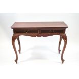 A mahogany side table with two frieze drawers, shaped apron and cabriole legs,