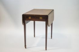 A 19th century mahogany Pembroke table on square tapering legs with spade feet 72.