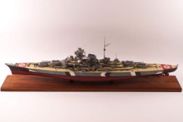 A late 20th century kit model of the Bismarck, on rectangular mahogany plinth,