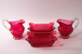 A pair of Victorian cranberry flash cut glass rectangular bowls and a pair of bowls