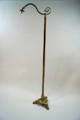A Victorian brass standard lamp, converted to electricity,