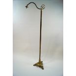 A Victorian brass standard lamp, converted to electricity,