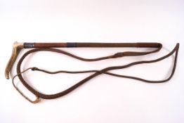 A hunting crop with horn handle, plaited leather thong and silver mounts, engraved monogram R.W.