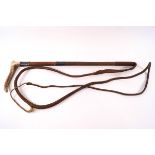 A hunting crop with horn handle, plaited leather thong and silver mounts, engraved monogram R.W.