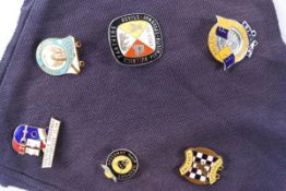 Six enamel speedway badges