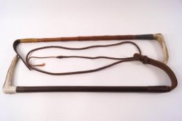 A bamboo riding crop with silver collar and horn handle,